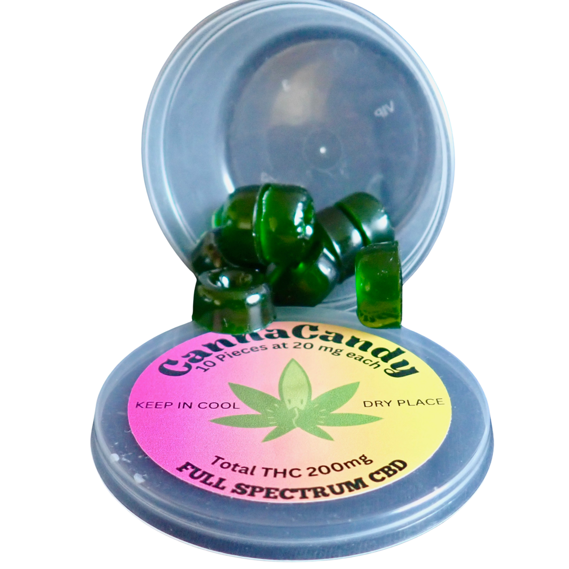 This image shows a plastic container with its lid open. Inside are green, square-shaped candies spilling out. The lid has a colorful label with a cannabis leaf in the center, stating "CannaCandy," "10 pieces at 20mg each," "Total THC 200mg," and "Full Spectrum CBD."
