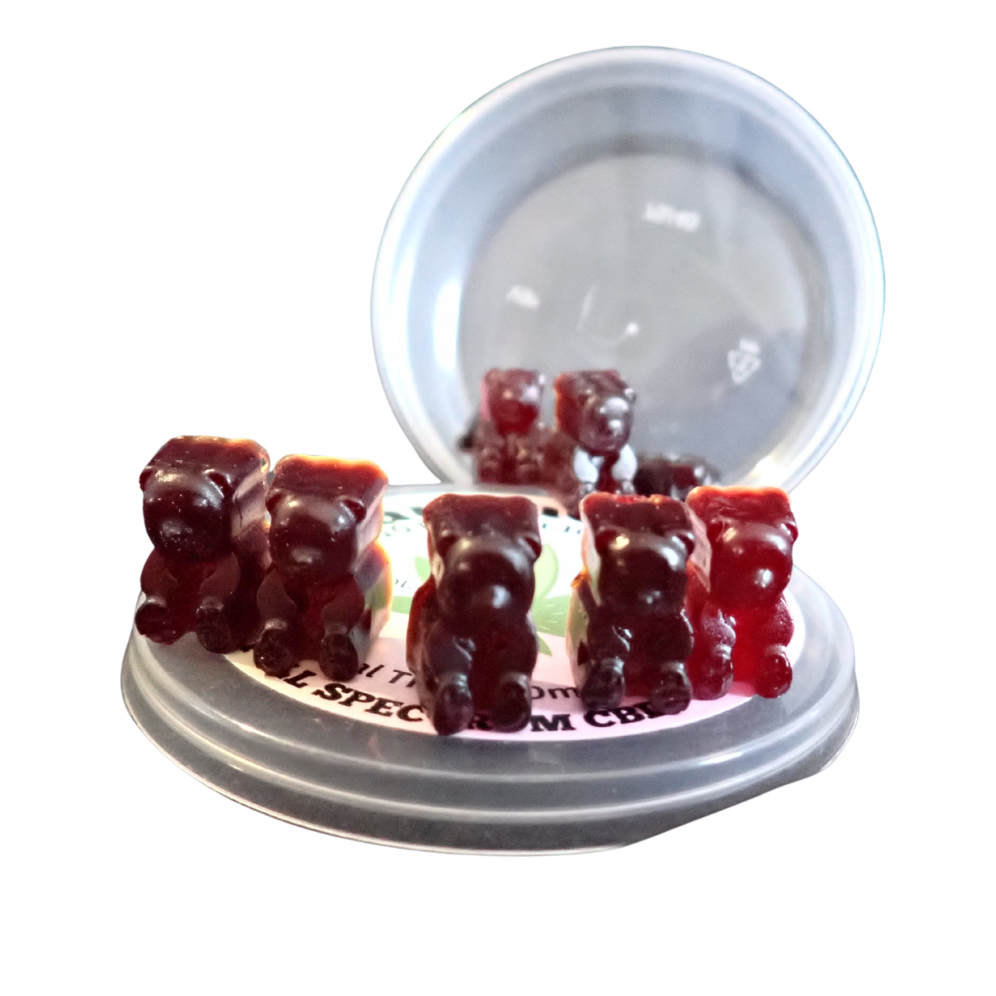 Five red gummy bears displayed on a CannaCandy container lid with open container in the background, full spectrum CBD.