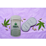 HBN Sleep capsule bottle with a sleep mask and leaves on a purple background