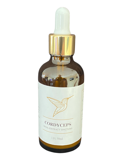 A bottle of Cordyceps dual extract tincture with a dropper, featuring a minimalist label design with a gold hummingbird logo.